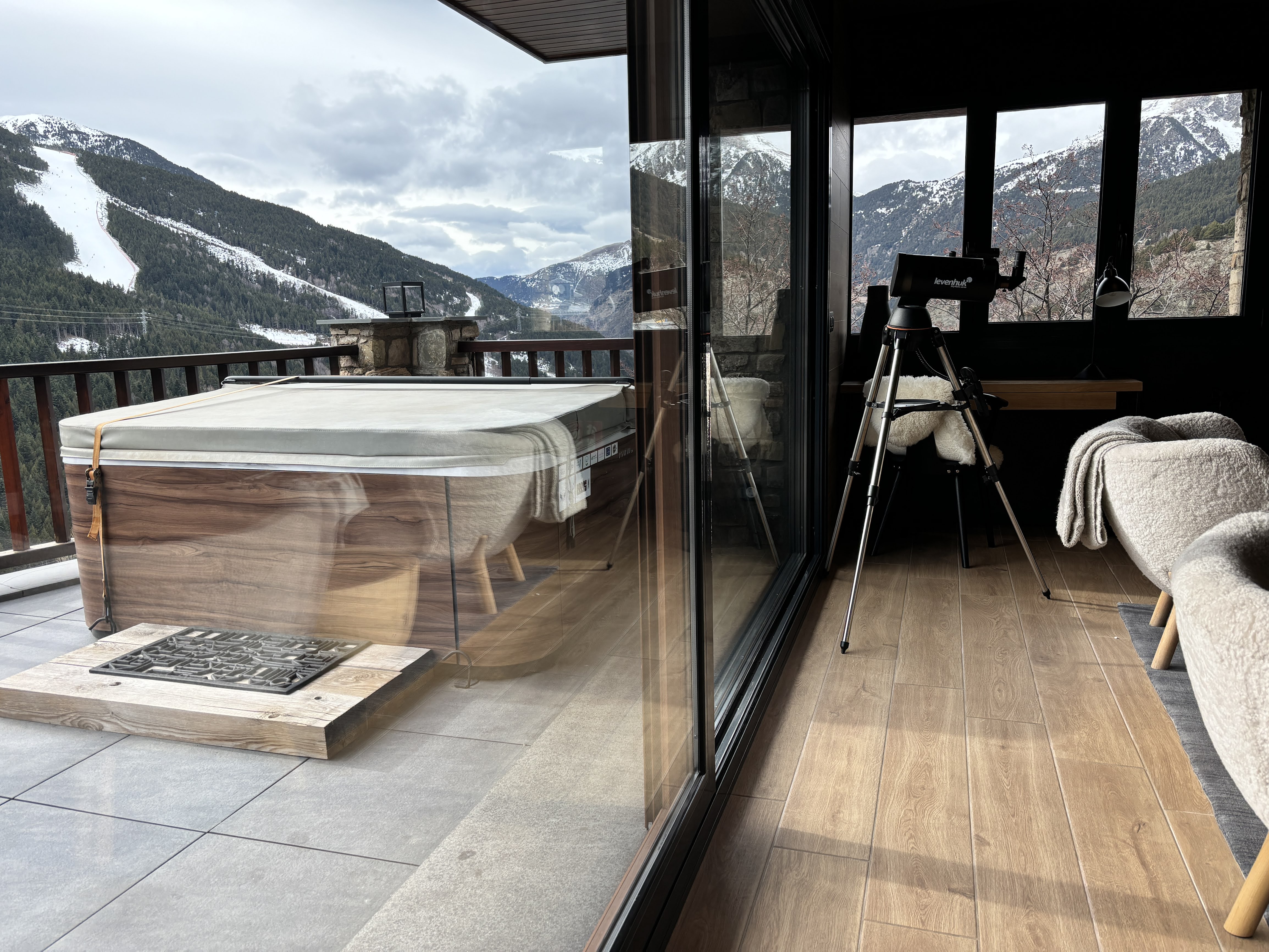 Private hot tub on a terrace with mountain views at sunset